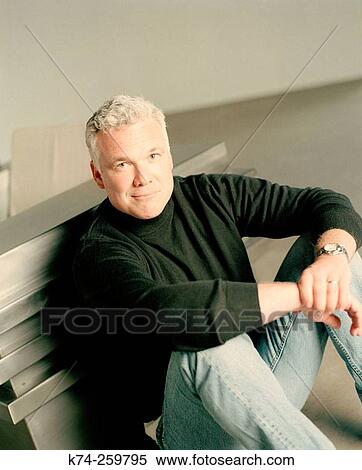 Casual Man Sitting On Floor View Large Photo Image Stock Photography - Casual Man Sitting On Floor. Fotosearch