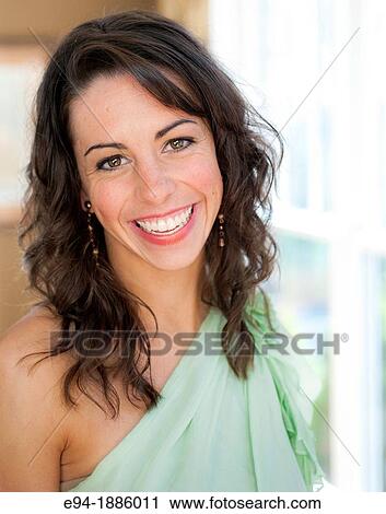 Casual portrait of a 22 year old brunette woman smiling at the camera View Large Photo Image Stock Image - Casual portrait of a 22 year old brunette woman smiling at the camera. Fotosearch