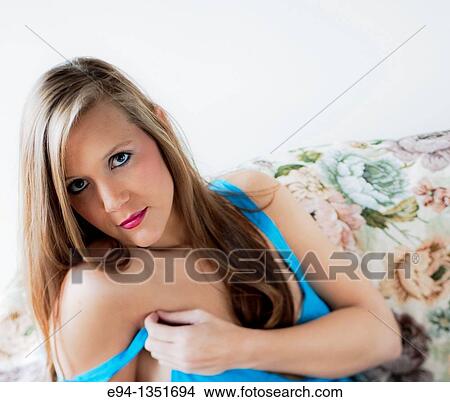 Picture - Casual portrait of a 26 year old brunette woman in a home setting. Fotosearch
