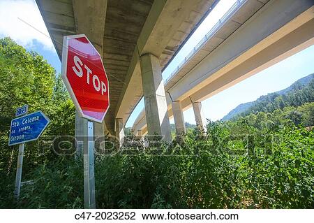 Catalunya, Spain, Girona province, La Selva area, C25, Eix Transversal, viaduct over GI-551 local road from Santa Coloma de Farners to Sant Hilari de Sacalm near Sant Marti de Claders. Stop signal. View Large Photo Image Stock Image - Catalunya, Spain, Girona province, La Selva area, C25, Eix Transversal, viaduct over GI-551 local road from Santa Coloma de Farners to Sant Hilari de Sacalm near Sant Marti de Claders. Stop signal.. Fotosearch