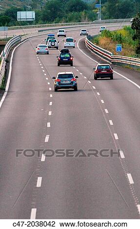 Catalunya, Spain, Girona province, Giron's area, Traffic at the AP-7 Autopista del MediterrBneo near Pont de Molins. The Autopista AP-7 is a Spanish highway and a toll motorway that runs along the Mediterranean coast of Spain. View Large Photo Image Stock Image - Catalunya, Spain, Girona province, Giron's area, Traffic at the AP-7 Autopista del MediterrBneo near Pont de Molins. The Autopista AP-7 is a Spanish highway and a toll motorway that runs along the Mediterranean coast of Spain.. Fotosearch