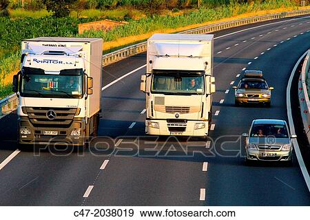 Catalunya, Spain, Girona province, Giron's area, Traffic at the AP-7 Autopista del MediterrBneo near Pont de Molins. The Autopista AP-7 is a Spanish highway and a toll motorway that runs along the Mediterranean coast of Spain. View Large Photo Image Stock Photo - Catalunya, Spain, Girona province, Giron's area, Traffic at the AP-7 Autopista del MediterrBneo near Pont de Molins. The Autopista AP-7 is a Spanish highway and a toll motorway that runs along the Mediterranean coast of Spain.. Fotosearch