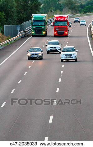 Catalunya, Spain, Girona province, Giron's area, Traffic at the AP-7 Autopista del MediterrBneo near Pont de Molins. The Autopista AP-7 is a Spanish highway and a toll motorway that runs along the Mediterranean coast of Spain. View Large Photo Image Stock Photo - Catalunya, Spain, Girona province, Giron's area, Traffic at the AP-7 Autopista del MediterrBneo near Pont de Molins. The Autopista AP-7 is a Spanish highway and a toll motorway that runs along the Mediterranean coast of Spain.. Fotosearch