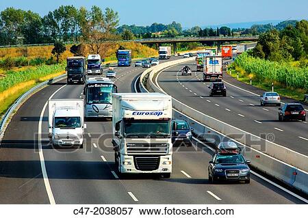 Catalunya, Spain, Girona province, Giron's area, Traffic at the AP-7 Autopista del MediterrBneo near Pont de Molins. The Autopista AP-7 is a Spanish highway and a toll motorway that runs along the Mediterranean coast of Spain. View Large Photo Image Stock Photo - Catalunya, Spain, Girona province, Giron's area, Traffic at the AP-7 Autopista del MediterrBneo near Pont de Molins. The Autopista AP-7 is a Spanish highway and a toll motorway that runs along the Mediterranean coast of Spain.. Fotosearch