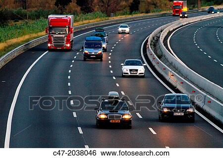 Catalunya, Spain, Girona province, Giron's area, Traffic at the AP-7 Autopista del MediterrBneo near Pont de Molins. The Autopista AP-7 is a Spanish highway and a toll motorway that runs along the Mediterranean coast of Spain. View Large Photo Image Stock Photograph - Catalunya, Spain, Girona province, Giron's area, Traffic at the AP-7 Autopista del MediterrBneo near Pont de Molins. The Autopista AP-7 is a Spanish highway and a toll motorway that runs along the Mediterranean coast of Spain.. Fotosearch