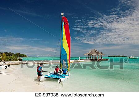 Catamaran on Beach of Maldive Island Kandooma, South Male Atoll, Maldives View Large Photo Image Stock Photo - Catamaran on Beach of Maldive Island Kandooma, South Male Atoll, Maldives. Fotosearch