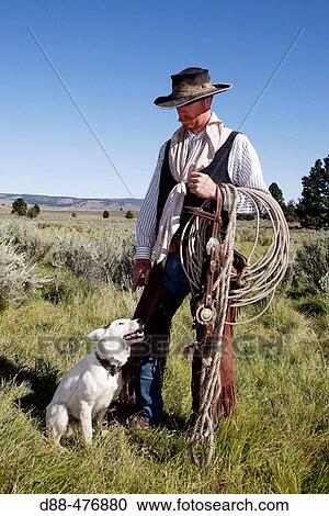 Cattleman with border collie. Ponderosa Ranch. Seneca. Oregon. USA View Large Photo Image Stock Image - Cattleman with border collie. Ponderosa Ranch. Seneca. Oregon. USA. Fotosearch