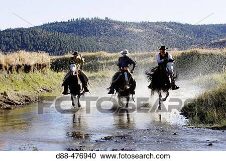 Stock Image - Cattlemen with? Quarter horse? and/or? Paint? of USA. Ponderosa Ranch. Seneca. Oregon. USA. Fotosearch