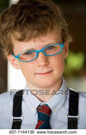 Stock Photo - Caucasian boy wearing glasses. Fotosearch
