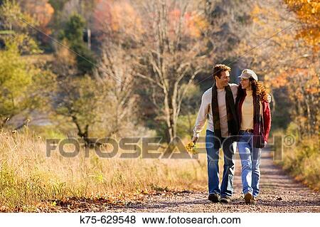 Caucasian couple, age 30's to 40? s, autumn, country, scarves, northeast USA View Large Photo Image Stock Photo - Caucasian couple, age 30's to 40? s, autumn, country, scarves, northeast USA. Fotosearch
