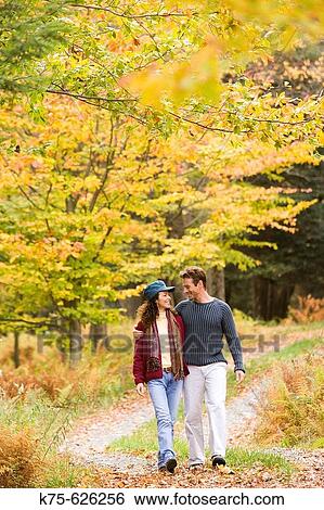 Stock Photograph - Caucasian couple, age 30's to 40? s, outdoors, country, walking, autumn. Fotosearch