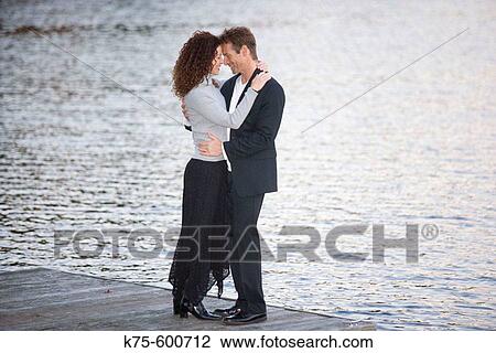 Caucasian couple, ages 30's to 40? s, dock, lake View Large Photo Image Stock Image - Caucasian couple, ages 30's to 40? s, dock, lake. Fotosearch