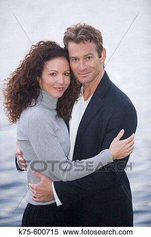 Stock Photography - Caucasian couple, ages 30's to 40? s, lake, portrait, smiling, romance. Fotosearch