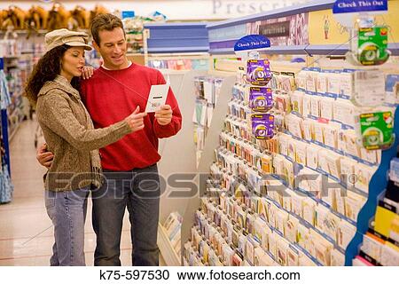 Caucasian couple shopping greeting cards. View Large Photo Image Stock Image - Caucasian couple shopping greeting cards.. Fotosearch