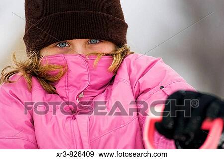 Caucasian female child playing in the snow View Large Photo Image Stock Photo - Caucasian female child playing in the snow. Fotosearch