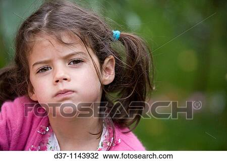 Caucasian girl with a naughty expression View Large Photo Image Stock Image - Caucasian girl with a naughty expression. Fotosearch