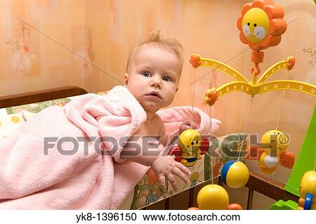 Caucasian Infant Playing with Hanging Bed Toys View Large Photo Image Stock Image - Caucasian Infant Playing with Hanging Bed Toys. Fotosearch