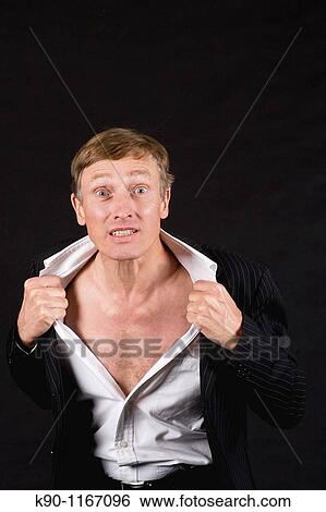 Caucasian man pulling his white shirt open, studio shot View Large Photo Image Stock Photograph - Caucasian man pulling his white shirt open, studio shot. Fotosearch