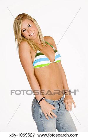 Stock Photo - Caucasian teen in swimsuit and jeans. Fotosearch