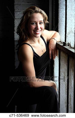 Stock Photo - Caucasian woman looking into the camera. Fotosearch