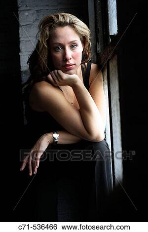 Caucasian woman looking into the camera View Large Photo Image Stock Photograph - Caucasian woman looking into the camera. Fotosearch