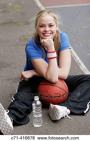 Stock Photo - Caucasian woman on basketball court. Fotosearch