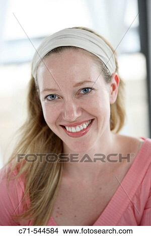 Caucasian woman smiling into camera View Large Photo Image Picture - Caucasian woman smiling into camera. Fotosearch