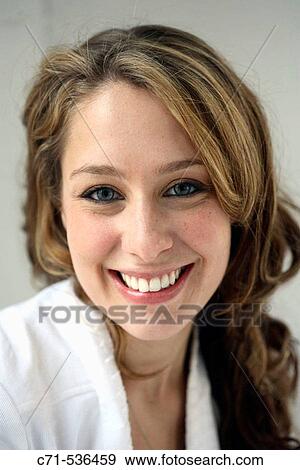 Caucasian woman smiling into the camera View Large Photo Image Stock Photo - Caucasian woman smiling into the camera. Fotosearch