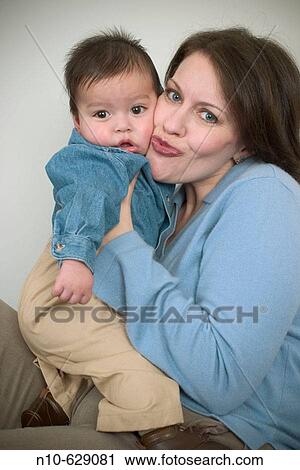 Caucasian woman with her Eurasian toddler son. View Large Photo Image Stock Image - Caucasian woman with her Eurasian toddler son.. Fotosearch