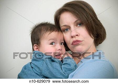 Stock Photo - Caucasian woman with her Eurasian toddler son.. Fotosearch