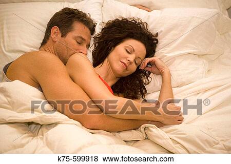 Caucasians, couple, age 30's to 40? s, bed, sleeping, hugging. View Large Photo Image Stock Photo - Caucasians, couple, age 30's to 40? s, bed, sleeping, hugging.. Fotosearch