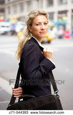 Stock Image - Caucassian businesswoman looking into camera. Fotosearch