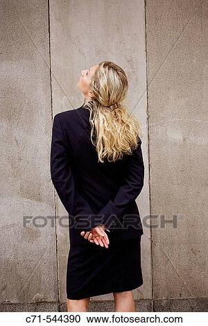 Stock Image - Caucassian businesswoman with back to camera. Fotosearch