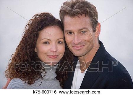 Stock Photograph - Caucausian couple, portrait, age 30's to 40? s. Fotosearch