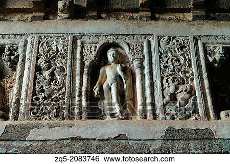 Stock Photograph - Cave 19: Buddha in different poses on pillars. Ajanta Caves, Aurangabad, Maharashtra, India.. Fotosearch