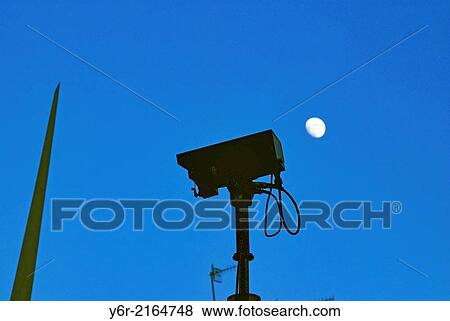 CCTV camera facing London Bridge and civic art in Southwark, London, England, at dusk, with the moon in the background. View Large Photo Image Stock Photo - CCTV camera facing London Bridge and civic art in Southwark, London, England, at dusk, with the moon in the background.. Fotosearch