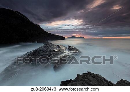 Cebollero Cape Cliffs in Sonabia, Orion, Cantabria Spain. The waves break hard during bad weather. View Large Photo Image Stock Image - Cebollero Cape Cliffs in Sonabia, Orion, Cantabria Spain. The waves break hard during bad weather.. Fotosearch