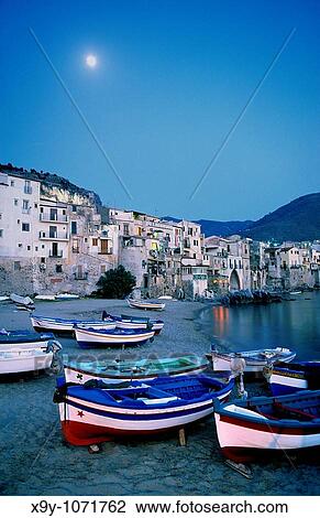 Cefalu, Sicily, Italy Full moon in summer evening sky over the fishing harbour of the town of Cefalu View Large Photo Image Stock Image - Cefalu, Sicily, Italy Full moon in summer evening sky over the fishing harbour of the town of Cefalu. Fotosearch