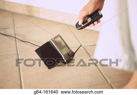 Stock Image - Cell phone and palm pilot. Fotosearch