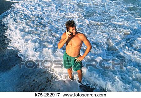 cell phone use at the beach View Large Photo Image Stock Photo - cell phone use at the beach. Fotosearch