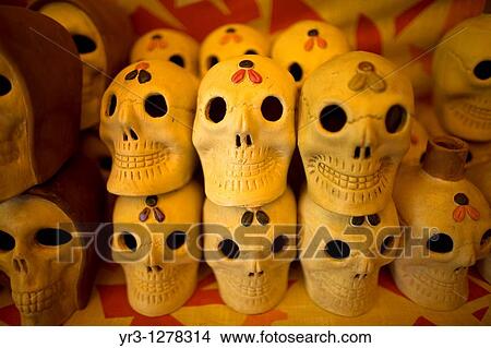 Ceramic skulls sit for sale ahead of Day of the Dead celebrations in a shop at the Jamaica Flower Market in Mexico City. View Large Photo Image Picture - Ceramic skulls sit for sale ahead of Day of the Dead celebrations in a shop at the Jamaica Flower Market in Mexico City.. Fotosearch