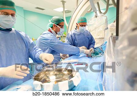 Stock Photograph - Cerebral aneurysm embolization, Interventional Neuroradiology, Radiology Department, Donostia Hospital, San Sebastian, Donostia, Gipuzkoa, Basque Country, Spain. Fotosearch