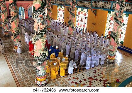 Stock Photography - Ceremony in Cao Dai temple, Tay Ninh, Vietnam. Fotosearch