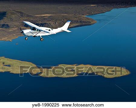 Cessna flying, Iceland. View Large Photo Image Stock Photography - Cessna flying, Iceland.. Fotosearch
