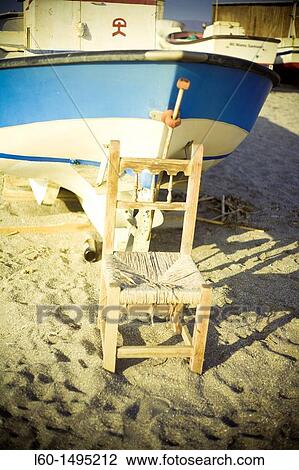 Chair and boat, Cabo de Gata, Almeria, Spain View Large Photo Image Stock Image - Chair and boat, Cabo de Gata, Almeria, Spain. Fotosearch