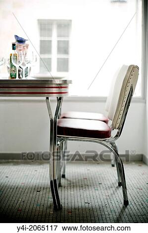 Stock Photo - Chair and table. Le Comestible. French restaurant in Bordeaux. Bordeaux. Gironde. Aquitaine. France. Europe.. Fotosearch