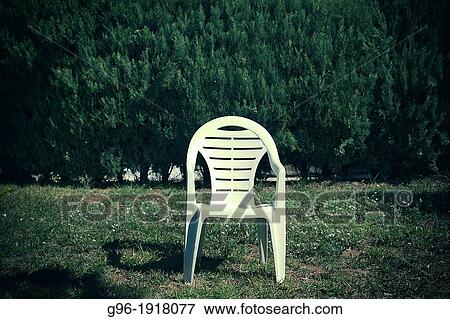 Chair in garden View Large Photo Image Stock Photo - Chair in garden. Fotosearch