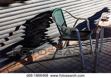 Chair on the street View Large Photo Image Stock Photo - Chair on the street. Fotosearch