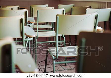 Chairs in an empty class View Large Photo Image Stock Photo - Chairs in an empty class. Fotosearch