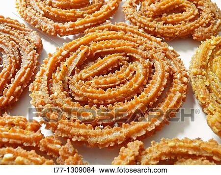 Chakri, Murukku, Chakli, Famous Crunchy Snack in India View Large Photo Image Picture - Chakri, Murukku, Chakli, Famous Crunchy Snack in India. Fotosearch